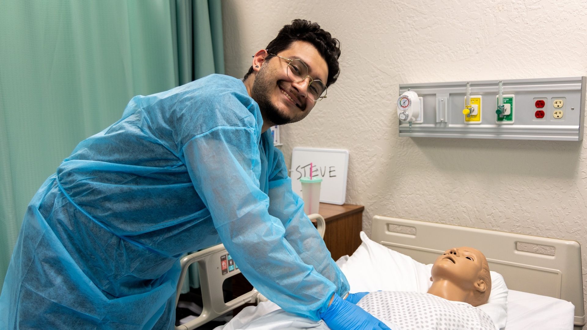Healthcare student gains hands-on clinical experience in a simulated patient care environment at Coconino Community College.